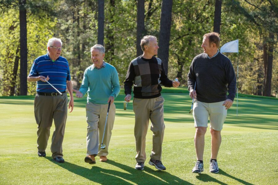 Senior men golfing